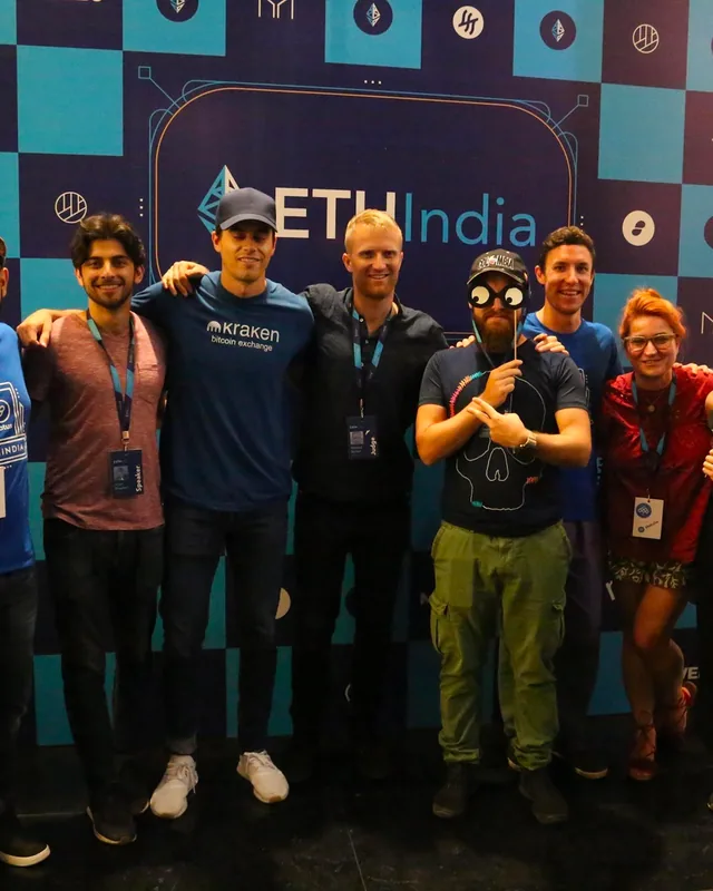A group of ETHIndia speakers in front of the backdrop, ETHIndia 2018