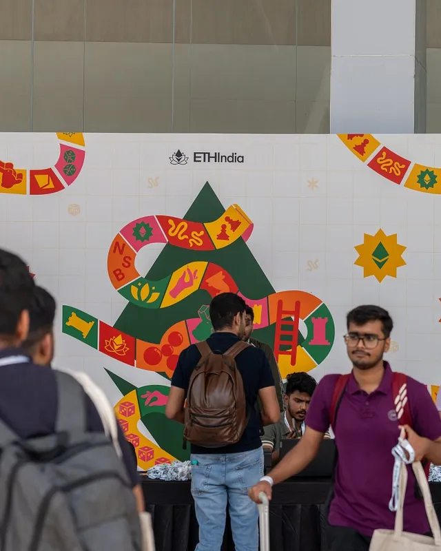 Attendees arriving past the ETHIndia 2024 welcome wall